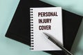 PERSONAL INJURY COVER - words in a white notebook against the background of a black notebook with a pen Royalty Free Stock Photo