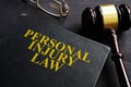 Personal Injury Law book and a black desk Royalty Free Stock Photo