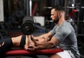 Personal instructor assisting young woman with bench press Royalty Free Stock Photo