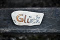 A personal lucky stone, painted by a child with the German word for luck