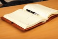 Personal organizer and pen on the table Royalty Free Stock Photo