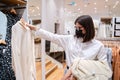 Personal private shopping tour with stylist.Professional individual assistance for client,shopper,woman in store.Choosing,buying Royalty Free Stock Photo