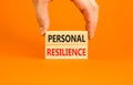 Personal resilience symbol. Concept word Personal resilience on wooden block. Beautiful orange table orange background. Royalty Free Stock Photo