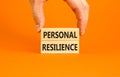 Personal resilience symbol. Concept word Personal resilience on wooden block. Beautiful orange table orange background. Royalty Free Stock Photo