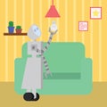 Domestic robot changing the bulb in living room.