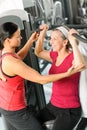 Personal trainer assist senior woman at gym Royalty Free Stock Photo