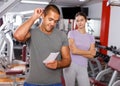 Trainer discussing workout plan with woman Royalty Free Stock Photo