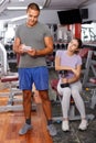 Trainer discussing workout plan with woman Royalty Free Stock Photo