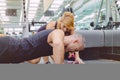 Personal trainer encouraging muscle man in push Royalty Free Stock Photo