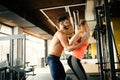 Personal trainer giving instructions in gym Royalty Free Stock Photo