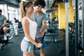Personal trainer giving instructions in modern gym Royalty Free Stock Photo