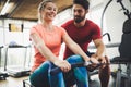 Personal trainer giving instructions a woman in gym Royalty Free Stock Photo