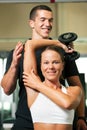 Personal Trainer in gym Royalty Free Stock Photo
