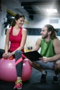 Personal trainer having a training consultation with a client. T Royalty Free Stock Photo