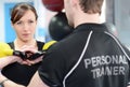 Personal trainer helping with stretches Royalty Free Stock Photo