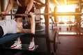 Personal trainer helping woman bench press Royalty Free Stock Photo