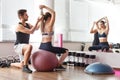 Personal trainer helping woman Royalty Free Stock Photo