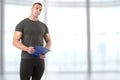 Personal Trainer Holding a Pad
