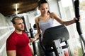 Personal trainer instructing trainee Royalty Free Stock Photo