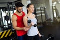 Personal trainer instructing trainee Royalty Free Stock Photo