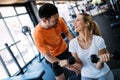 Personal trainer instructing trainee Royalty Free Stock Photo