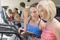 Personal Trainer Instructing Woman On Treadmill Royalty Free Stock Photo