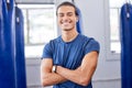 Personal trainer man, gym portrait and arms crossed with focus, wellness and health in workplace. Happy coach Royalty Free Stock Photo