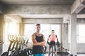 Personal trainer man crossed arms and coaching woman exercise workout in gym,Concept healthy and lifestyle Royalty Free Stock Photo