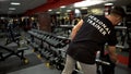 Personal trainer preparing training site for his clients gym, sport profession Royalty Free Stock Photo