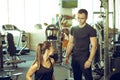 Personal trainer talks to his client. Royalty Free Stock Photo