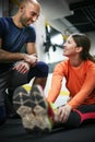 Personal trainer training his client in the gym. Royalty Free Stock Photo