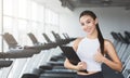 Personal trainer. Woman with clipboard showing thumb up Royalty Free Stock Photo