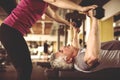 Personal trainer working exercise with senior man. Royalty Free Stock Photo