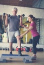 Personal trainer working exercise with senior man. Royalty Free Stock Photo