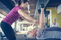 Personal trainer working exercise with senior man in the gym. Ma Royalty Free Stock Photo