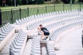 Personal trainer working out on stadium stairs, making leg workout