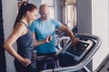 Personal training with a trainer on a treadmill Royalty Free Stock Photo