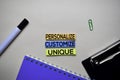 Personalize - Customize - Unique text on sticky notes with office desk concept