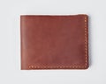 Personalized brown leather billfold wallet with embossing on white