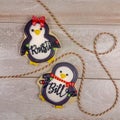 Personalized christmas penguins as decorated sugar cookies for gifts with generic names written in frosting