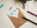 Personalized note with inscription Take Care in a natural color envelope Royalty Free Stock Photo