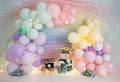 Personalized romantic colorful balloon decoration with colorful flowers and lights for 1st birthday