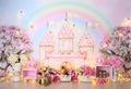 Personalized romantic decoration with colorful balloon arch, castles, flowers and lights for first birthday