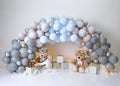 Personalized romantic decoration with colorful balloon arch, teddy bears and lights for 1st birthday