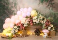 Personalized romantic garden decoration with colorful balloons, spring flowers and lights for first birthday