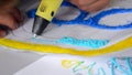 A persone drawing 3d pen close-up.