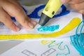 A persone drawing 3d pen that hardens in the air close-up.