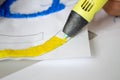 A persone drawing 3d pen that hardens in the air close-up.