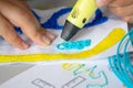 A persone drawing 3d pen that hardens in the air close-up. Royalty Free Stock Photo