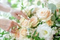 Elegant Handcrafted Floral Arrangement With Lush White Roses and Greenery on a Pastel Background